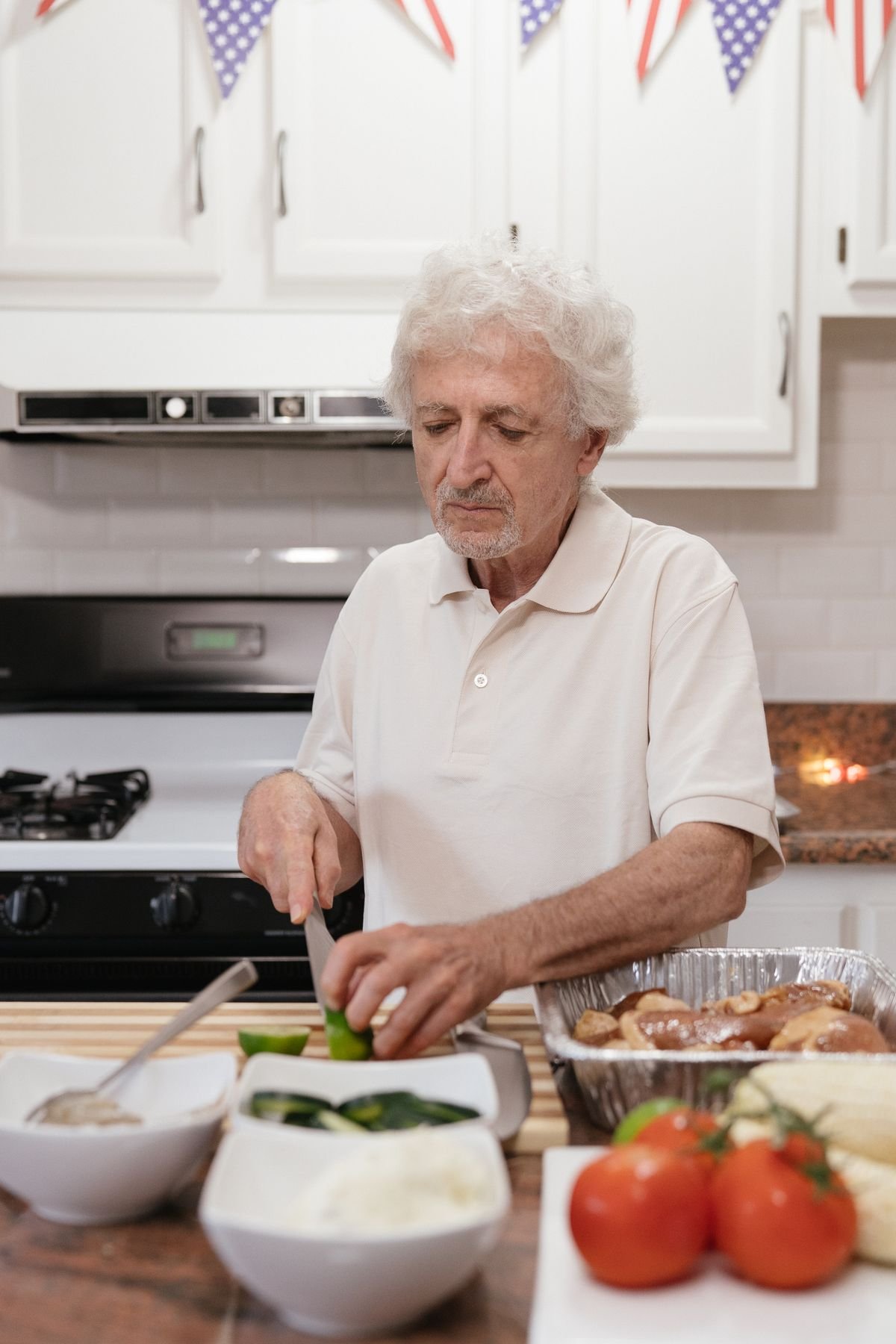 A man preparing a healthy meal at home in his kitchen